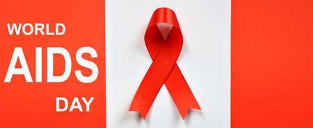 Red ribbon on white background. World Aids Day concept.