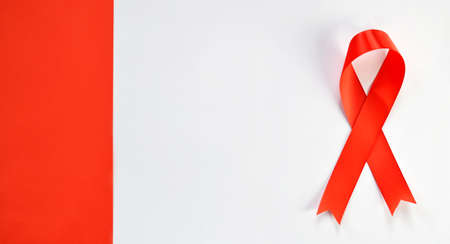 Red ribbon on white background. World Aids Day concept.の写真素材