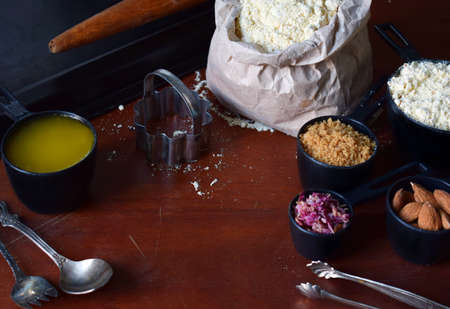 Making chickpea cookies pastries with almonds and tea rose petals. Traditional Eastern sweets. Gluten free. Grain free. Paleo diet. Healthy food.の写真素材