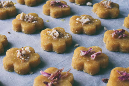 Chickpea cookies pastries with almonds and tea rose petals. Traditional Eastern sweets. Gluten free. Grain free. Paleo diet. Healthy foodの写真素材