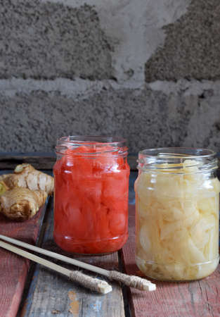 Pickled ginger slices and wooden chopsticks. Ingredient for sushi. Healthy food. Traditional Japanese condimentの写真素材