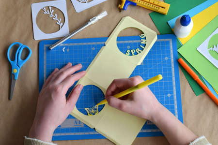 Making tunnelbook. 3D greeting card Spring . Artwork equipment and tools for paper cut - cutting...