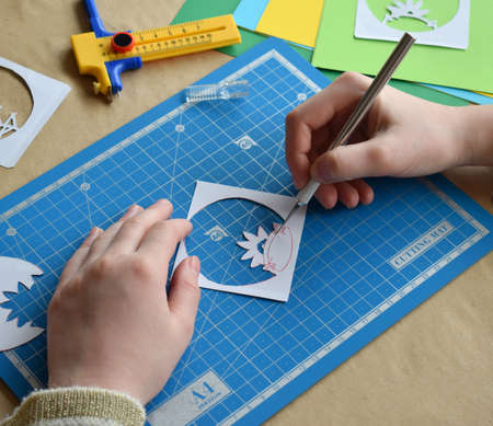 Making tunnelbook. 3D greeting card Spring . Artwork equipment and tools for paper cut - cutting...