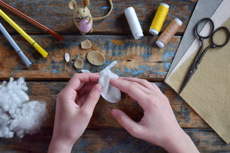 Making felt mouse. Sewing toy with your own hands. DIY concept for children. Handmade crafts. Step...