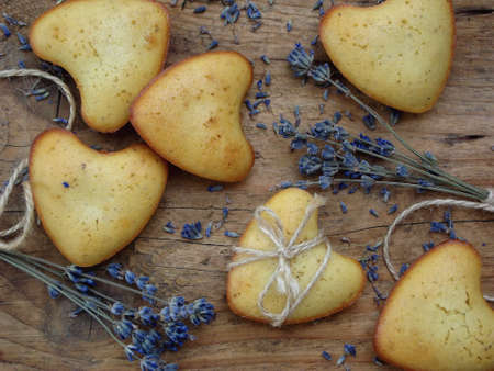 Freshly baked muffins with lavender. Healthy food concept. Savory pastry. Cupcakes on a wooden backgroundの写真素材