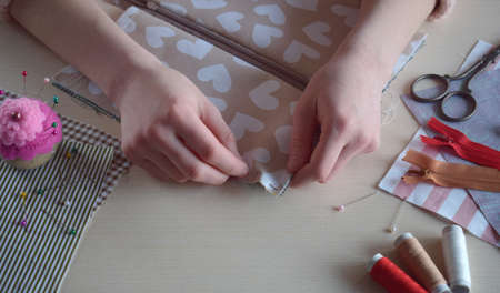 Making a textile pencil case. Sewing handmade cosmetic bag. step by step.の写真素材