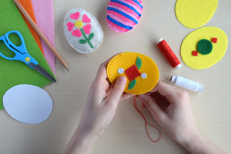 Making handmade easter eggs from felt with your own hands. Children's DIY concept. Easter decorationの写真素材
