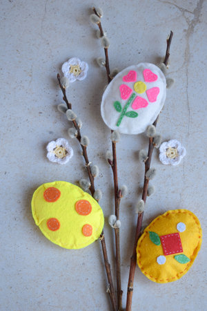 Bouquet of willow twigs and handmade easter eggs from felt. Children's DIY concept. Easter decorationの写真素材