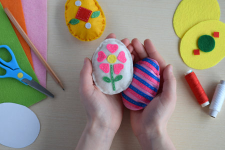 Making handmade easter eggs from felt with your own hands. Children's DIY concept. Easter decorationの写真素材