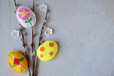 Bouquet of willow twigs and handmade easter eggs from felt. Children's DIY concept. Easter decorationの写真素材