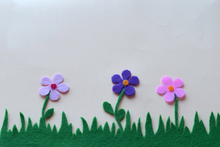 DIY felt garden, handmade spring floral composition, creative fabric flowers, green grass, colorful petals, home decor, textile craft, blooming nature, Easter decoration, soft pastel artの写真素材