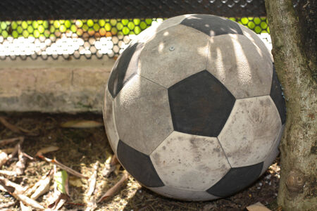The old and dirty  football have been left overの写真素材