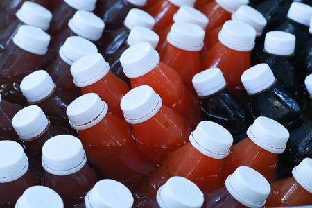 Bottle of healthy juice in cooled with ice cubesの写真素材