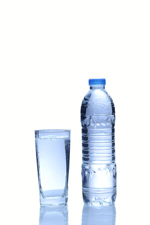 Water in plastic bottle with glass on white backgroundの写真素材