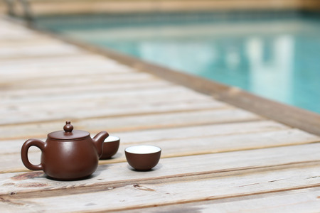 Having a chinese Tea by the swimmimg poolの写真素材