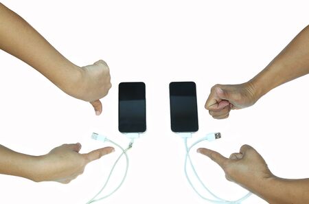 Concepts of safty , People thumb up and thumb down and pointing to USB cable conecting to cellphoneの写真素材
