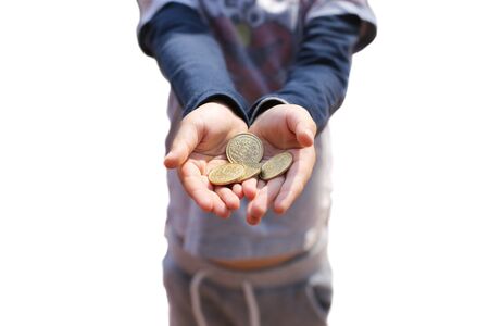 Child's Hand Holding Pretend Coins in white backgroundの写真素材