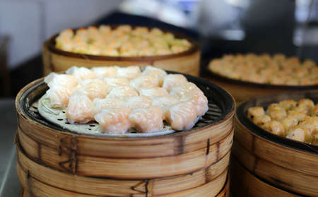 chinese steamed dimsum in bamboo containers traditional cuisineの写真素材