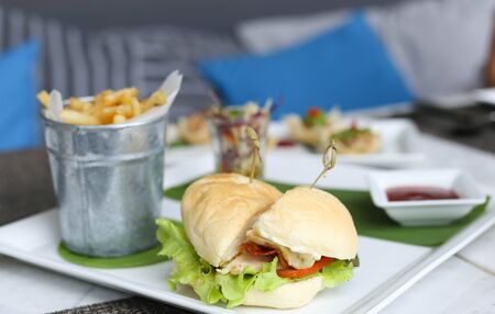 Burgers with french fried or chips  or chips in blur background