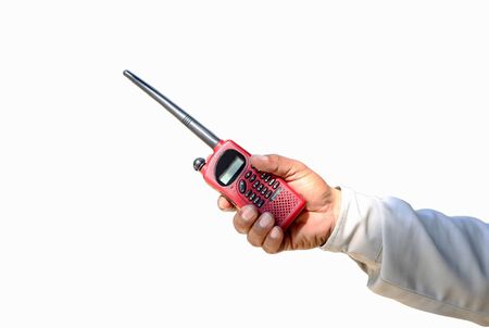 Security guard hand holding red cb walkie-talkie radio reaching outの写真素材