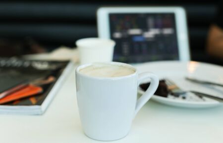 Coffee with Digital tablet computer on the tableの写真素材