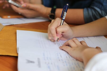 Bussines Women filling a Paperwork for agreementの写真素材