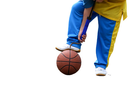 School boe hand pumping up basketball over white backgroundの写真素材