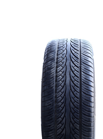 Used car tire isolated on white backgroundの写真素材