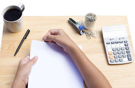 Concept business female hands with papers clips and calculator on tableの写真素材