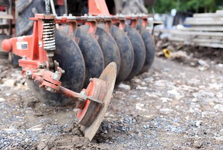 Tractor with metal blade at the construction siteの写真素材