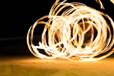 Group of people doing Fire show on beach party in Thailandの写真素材