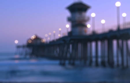 Blurry background Sunrise and sun set at Huntington Beach, California over the bridgeの写真素材