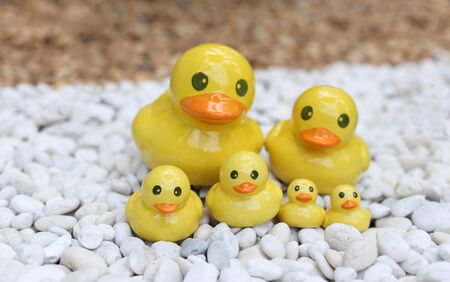 Group of duck statue on white and brown rock garden decoratedの写真素材