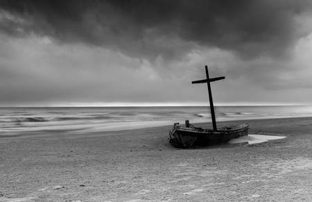 Wereck boat on the beach with storm cloud in contrast Black and Whiteの写真素材