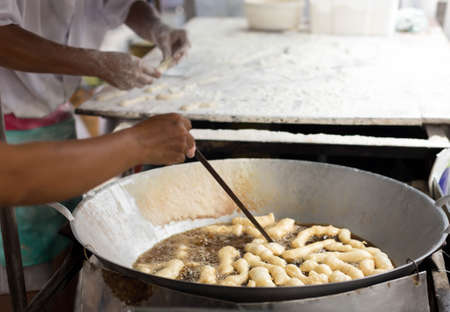 Deep-fried doughstick in the market in Thailandの写真素材
