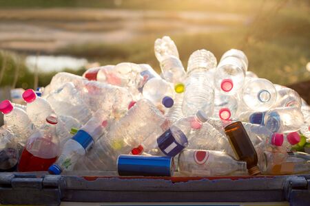 Recyclable garbage of glass and plastic bottles in rubbish bin
