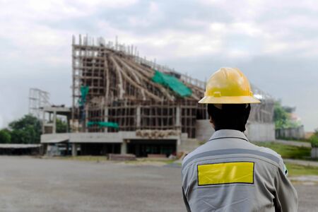 Engineer on building site construction in background