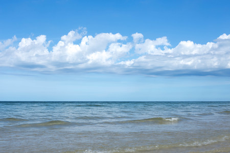 Beautiful sky with white cloud and water of the ocean in Thailandの写真素材