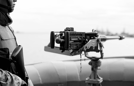 Machine gun and navy guard on the war ship in black and white