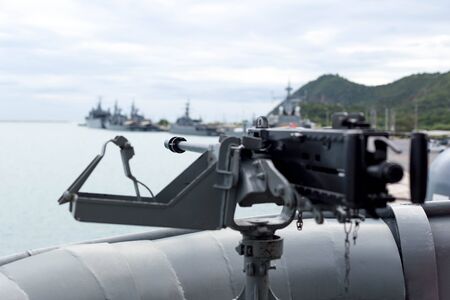 Selected focus Navy on machine gun on the thai warshipの写真素材