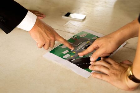 Business pointing on map Location Information on the tableの写真素材