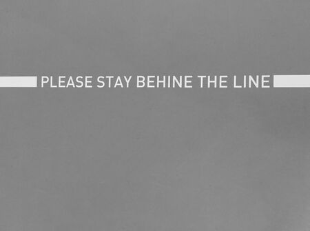 Conceptual safety Surface white line painted with letter massage sign on cement floor backgroundの写真素材