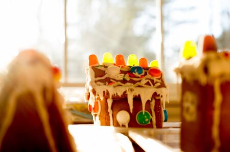Soft focus Gingerbread House on the table next to window with sunlightの写真素材