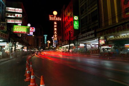 CHINATOWN, BANGKOK, THAILAND - Apr 27, 2017: At China Town bangkok cars light trail and shops and a lot off people at night timeのeditorial素材