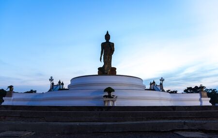 Silhouette standing big Buddha in blue sky in Phutthamonthon Thailand
