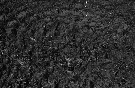 Motion wave of water surface background texture in black and whiteの写真素材