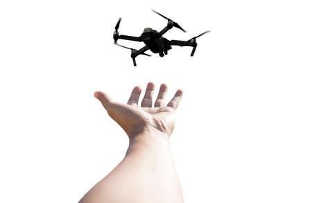 Hand with Quadcopter Drone isolated in white backgroundの写真素材