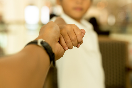 Family concept Father and Son hand holding handの写真素材
