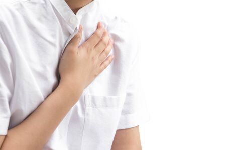 Woman having chest pain heart attack isolated in white backgroundの写真素材