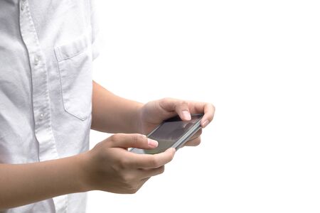 Young people using cell phone reading message outdoor isolated in white backgroundの写真素材